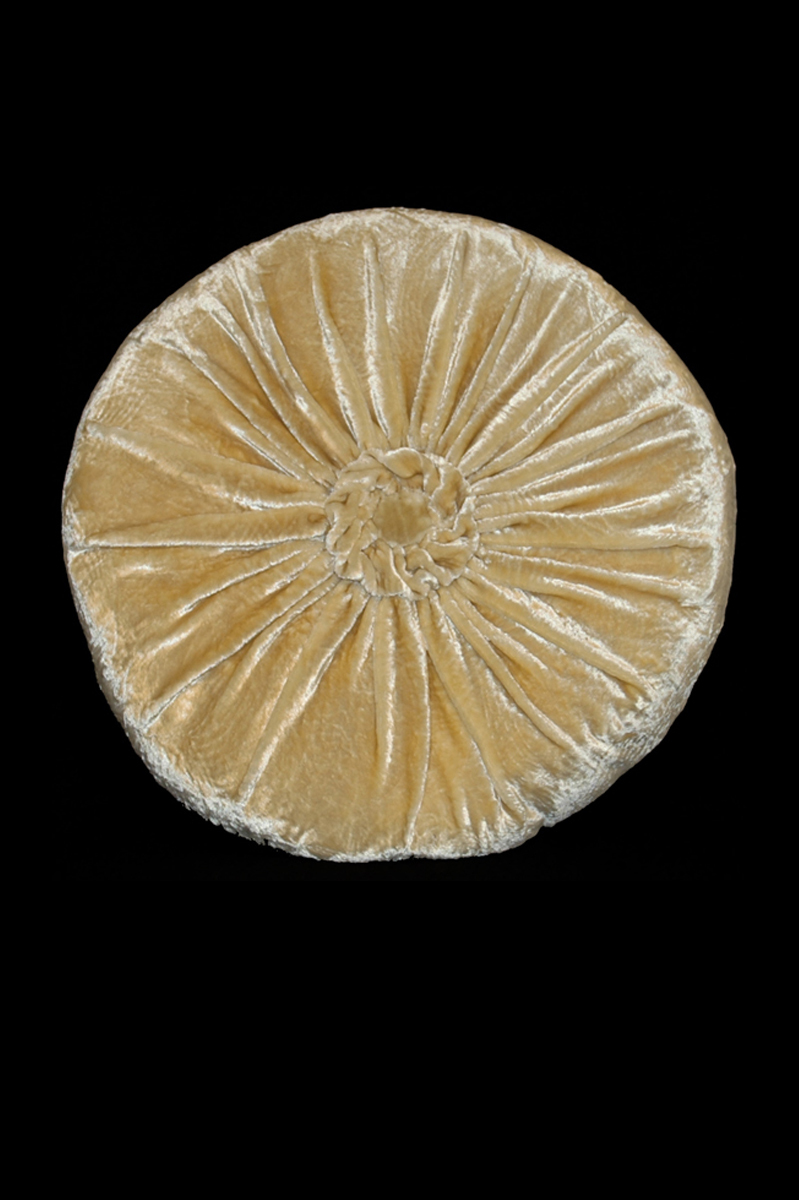 Delphos furrowed velvet rounded beige cushion