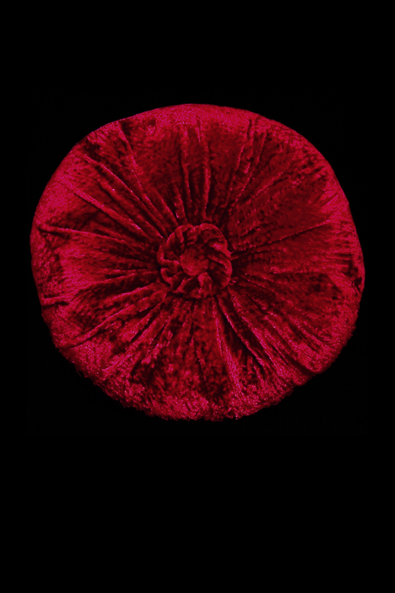 Delphos furrowed velvet rounded dark red cushion