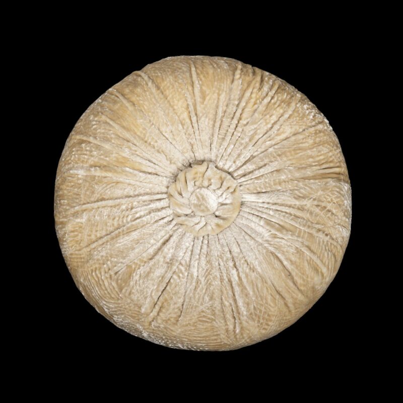 Furrowed velvet round ivory cushion