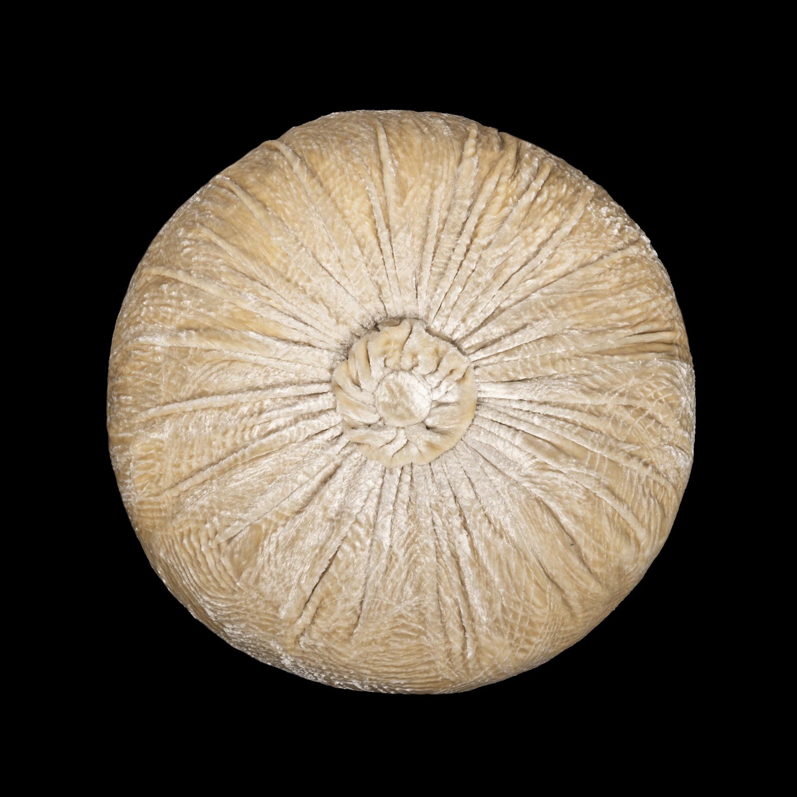 Furrowed velvet round ivory cushion
