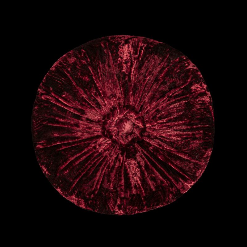 Furrowed velvet round ruby red cushion
